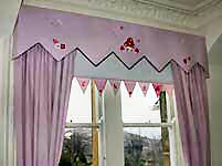 Peaked Pelform Pelmet with embroided design.