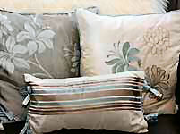 Square and piped cushion covers.