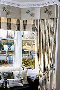 Silk interlined curtains with blinds and padded pelmet to match.
