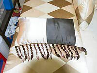 Oblong cushion with beading