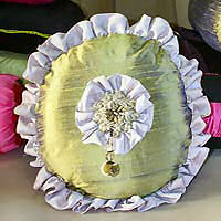 Cushion cover circular with centre and outside frills.