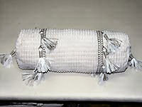 Bolster with tassels.