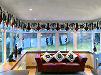 Heraldic pelmet in black and white with contrast red plates.